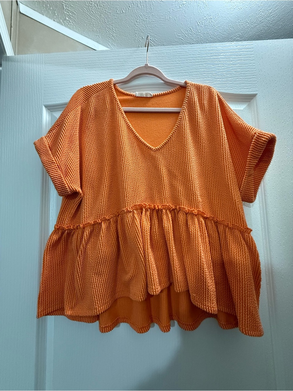 Jolie Orange V-Neck Ruffle Hem Knit Tunic